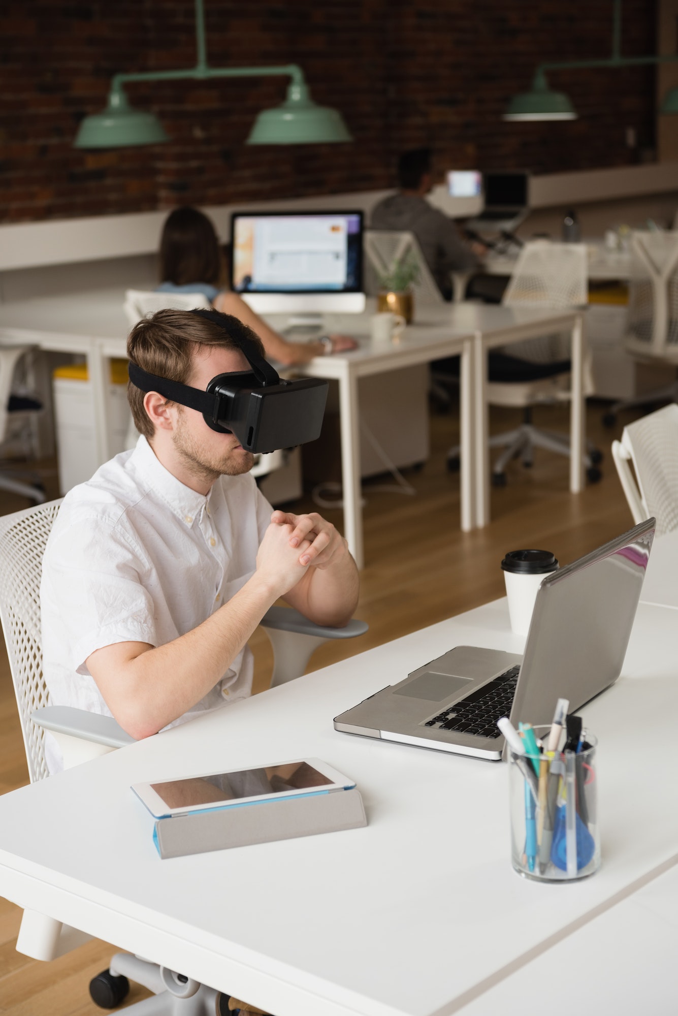 Male executive using virtual reality headset